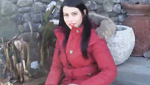 Lovely brunette gal Petra warms her feet up under the sun