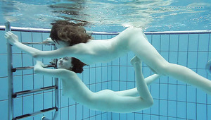 Cute teen chick Anna Netrebko swims naked with her GF
