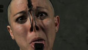 Skinny bald cutie gets her nose holes stuffed with metal hook