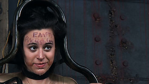 Chubby dark haired teen gets her body fastened in metal cage during BDSM sex play