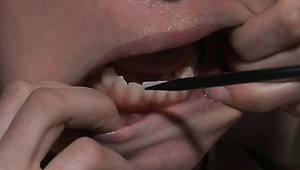 Ruined red-haired MILF gets her pussy lips stretched with metal pegs