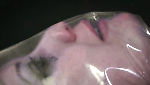 Submissive brunette chick is crucified for kinky breath play in dungeon