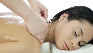 Brunette angel with skin covered with oil Betty enjoys full body massage
