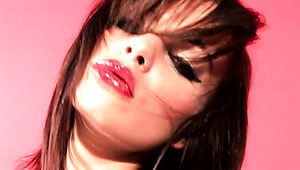 Sassy porn model Nina strips and shows off her shaved pussy